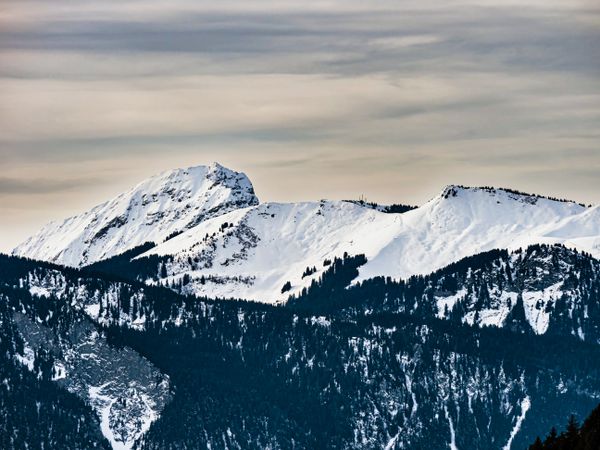 Swiss Alps winter landscape with snow and sun, mountains in Europe