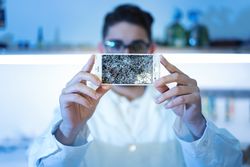 Man showing broken smartphone display