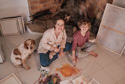 Happy sister and brother painting together