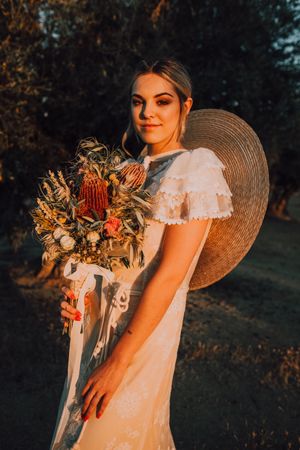 Woman in dress with flower bouquet