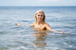 Mature woman in bathing in the sea