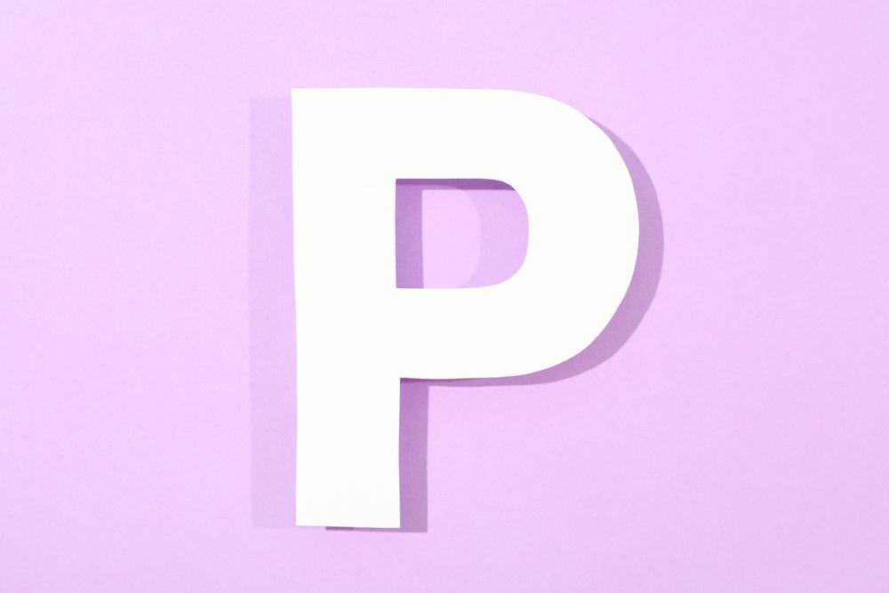 Paper letter P on color background, space for text