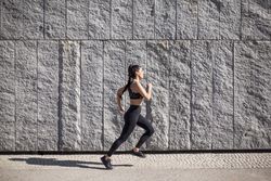 brunette woman running