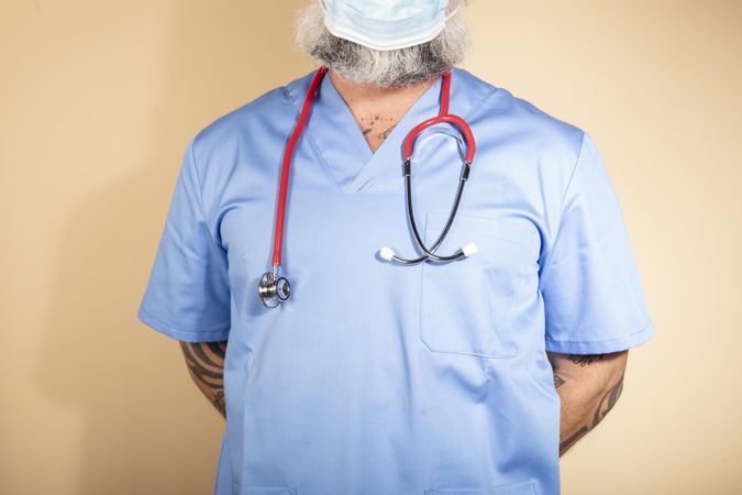 Healthcare worker in blue scrub with stethoscope