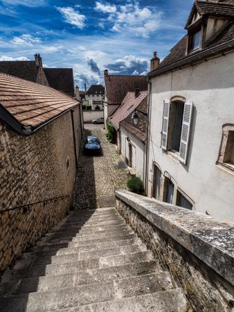 Empty streets of the medieval city of Beaune in Burgundy. The stormy sky