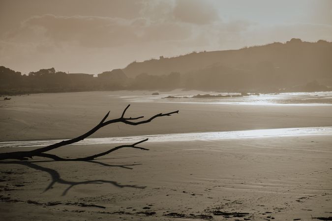Sandy beach surrounded with hills