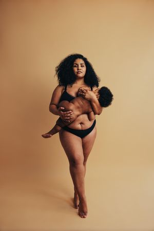 Postpartum mother breastfeeding her baby