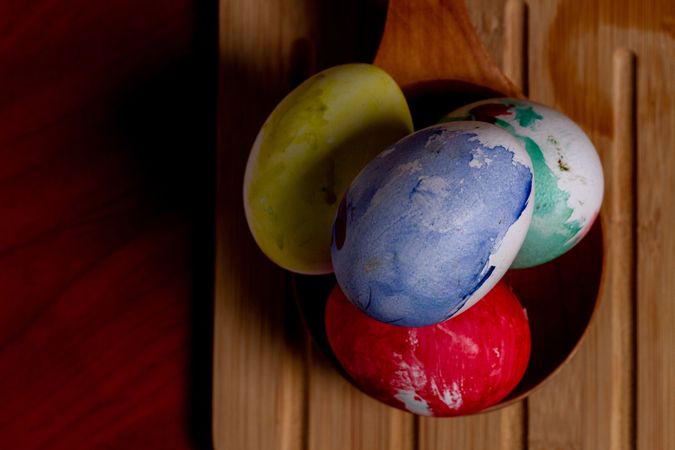 Set of painted Easter eggs on wooden spoon