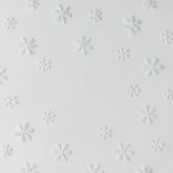 Winter snowflake pattern on light background
