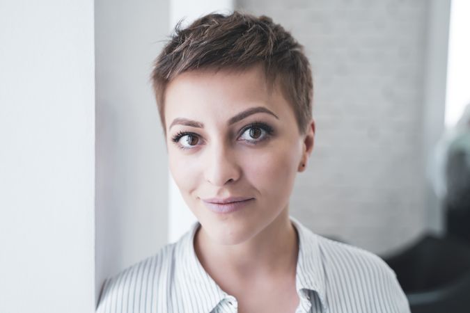 Woman posing after cutting her hair