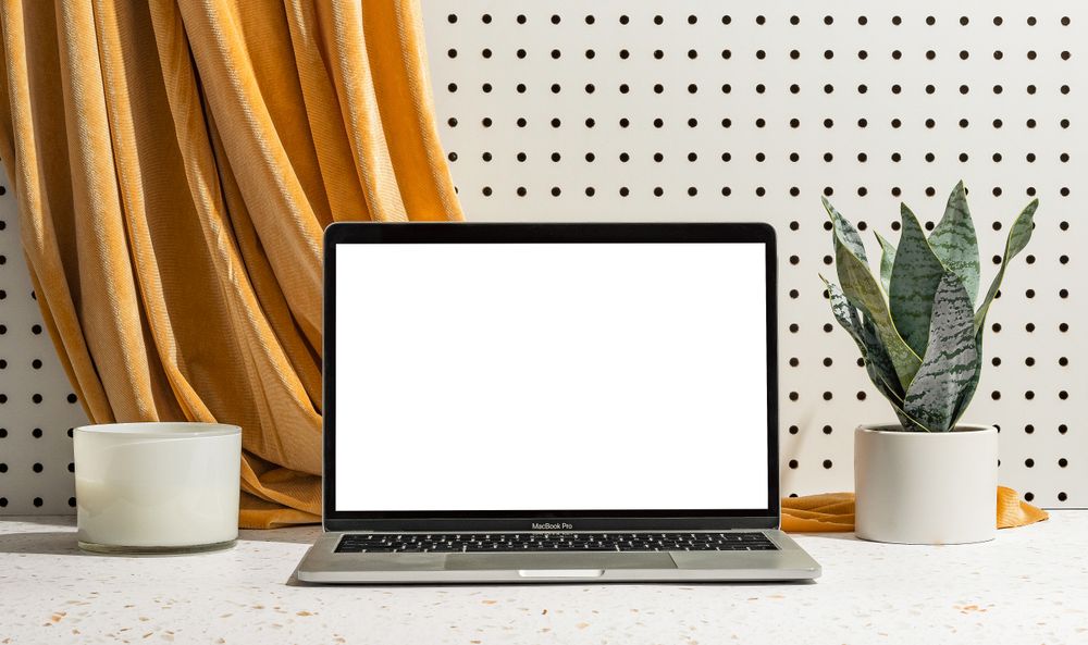 Laptop with blank screen for mock up on office desk