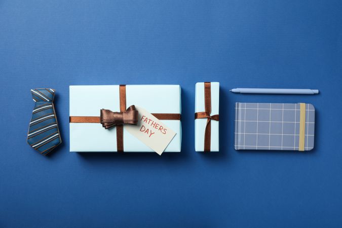 Gift for father, concept of world father's day, on blue background.
