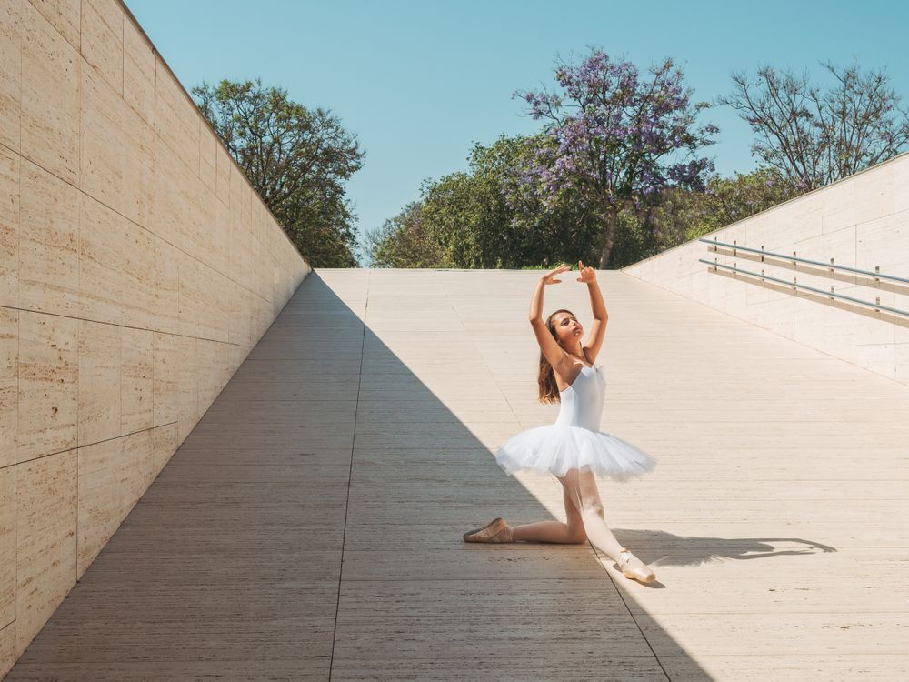 Ballerina performing classical position outside