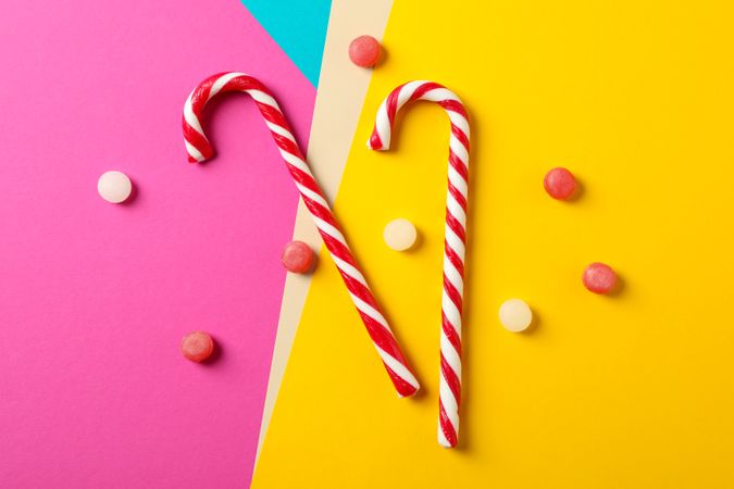 Composition with sweet candies on multicolored background, space for text