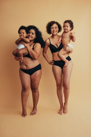 Real postpartum moms with their children