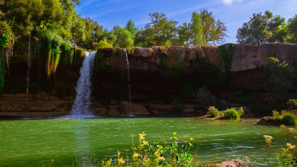 View of beautiful waterfall and lake