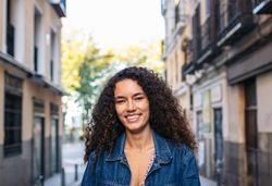 Portrait of a cheerful Latina woman outdoors