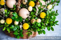 Eggs & flowers in decorative Easter basket bGR3EV