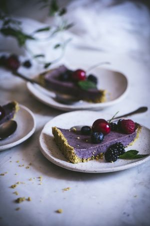Blueberry pistachio sliced cake with whole berries on top