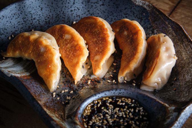 A typical Chinese dumpling that is very popular in China, Japan and Korea, as well as outside Asia. Jiaozi are stuffed with minced meat or vegetables and rolled into a thin, thin dough, which is usually sealed with the fingers.