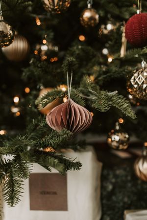 Brown paper ornament on a Christmas tree