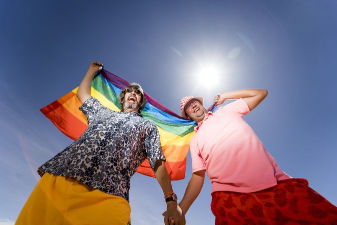 Excited gay couple in desert