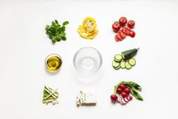 Salad ingredients and empty bowl