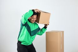 Online Motorcycle Driver Smiling While Driver Holding Carboard
