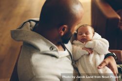 Top view shot of newborn baby boy in his father's arms 5pPB85