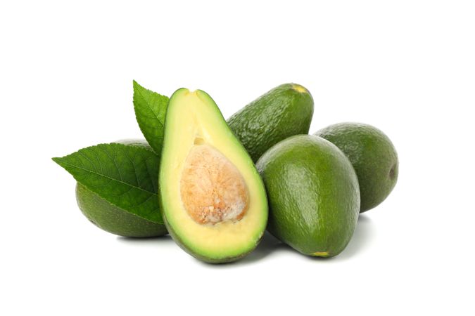 Ripe fresh avocado isolated on plain background