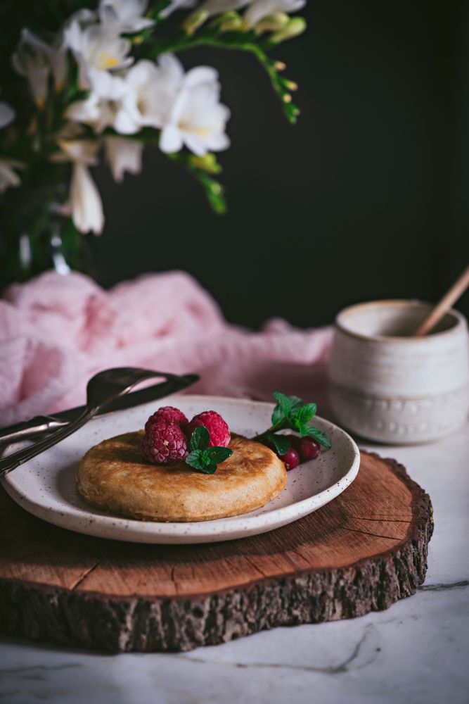 Pancake with fresh raspberry on plate