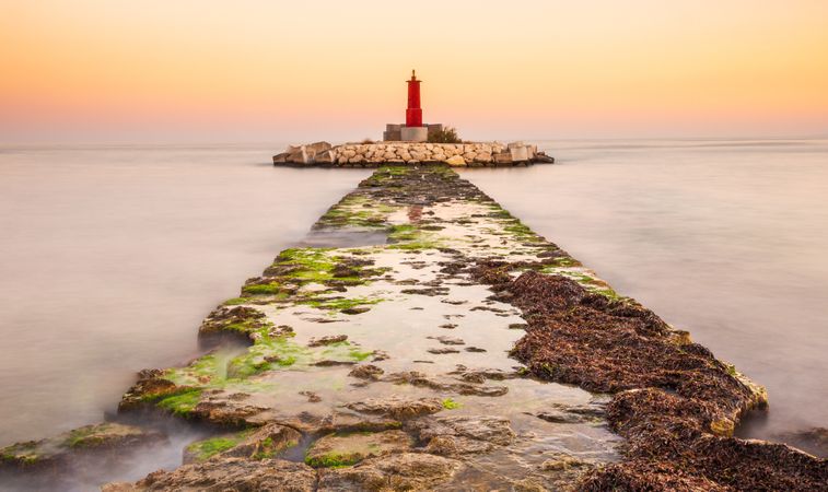 Rough path to islet with lighthouse