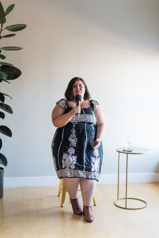 Woman public speaking with microphone