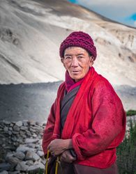 Tibet - August, 29 2014: Older Tibetan man in mountainous region