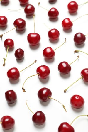Ripe juicy cherry fruits on a light background