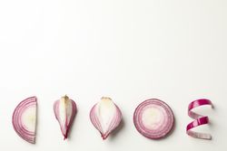 Flat lay composition with red onion on blank background