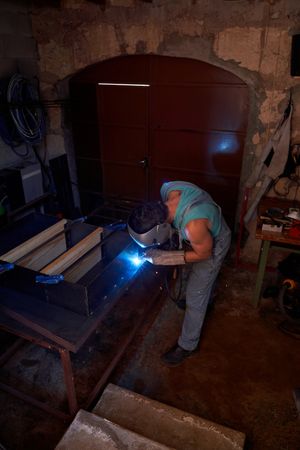 Anonymous welder welding metal structure