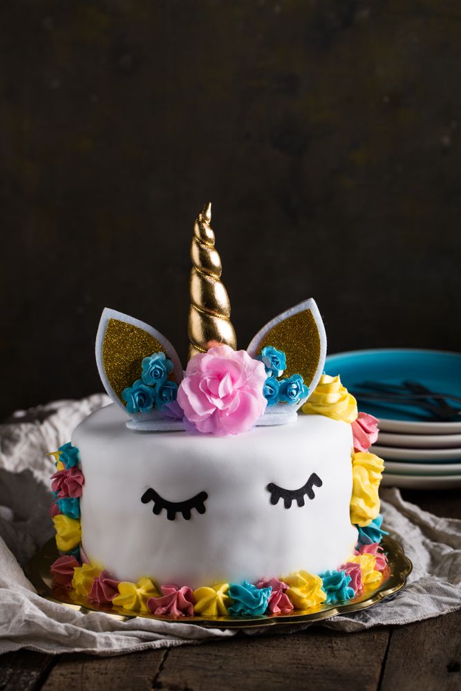 Cute unicorn cake with painted closed eyes