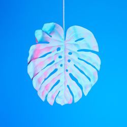 Tropical leaf in vibrant bold gradient holographic neon  colors