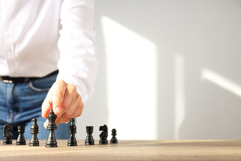 A man in a shirt with dark checkers