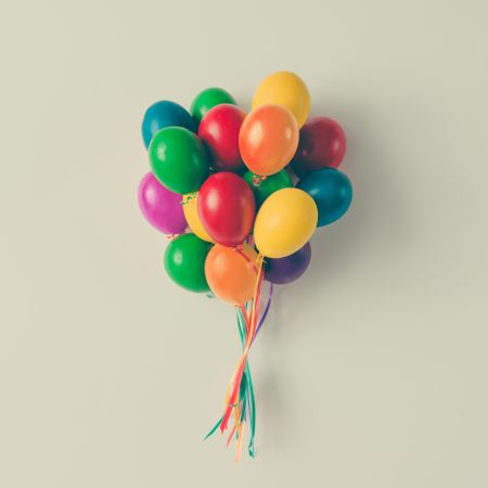 Colorful bunch of Easter egg balloons on light background