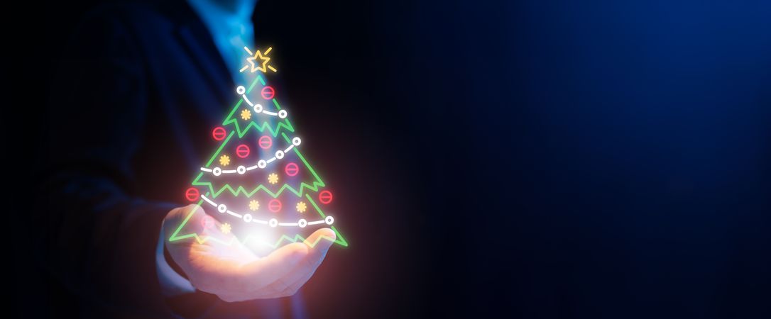 Businessman with holographic Christmas tree