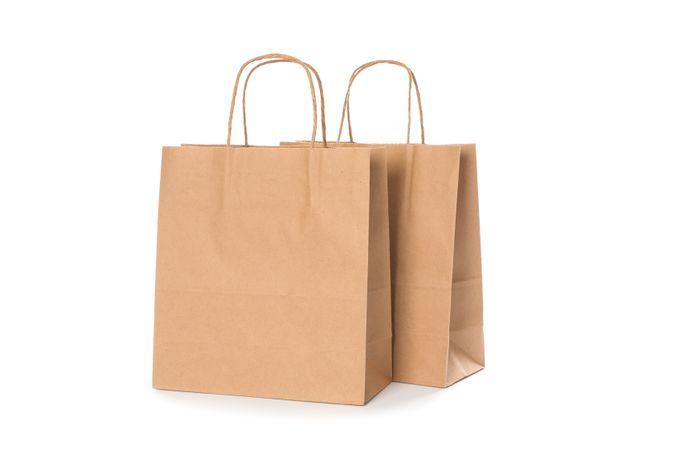 Empty paper bags isolated on blank background