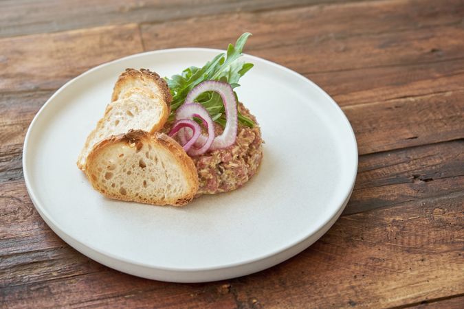 Appetizing steak tartare on white plate