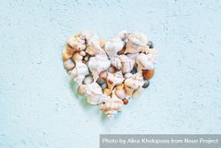 Heart made of seashells on blue background 5lnaVb