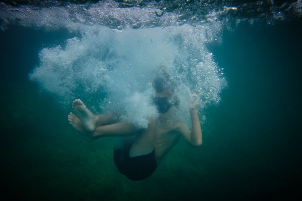 Boy underwater in clear sea
