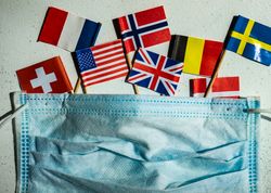 COVID-19 concept  with face mask and flags of countries