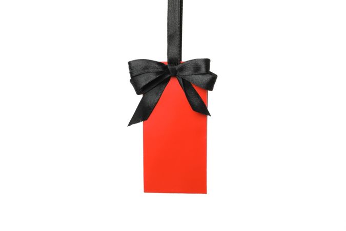 Blank red tag isolated on light background