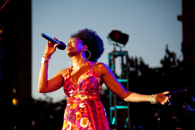 Los Angeles, CA, USA - July 12, 2012: Nailah Porter singing into microphone during a performance