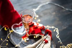 Champagne on trey with gift & silverware with fairy lights